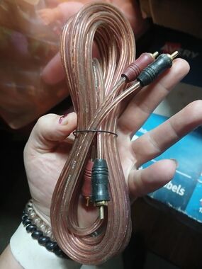 long, shielded RCA cable commonly used for connecting car or home audio amplifie